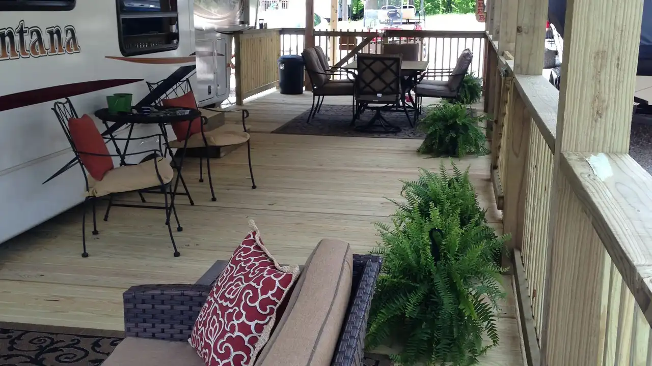 Close up on a plate of mashed potatoes, topped with baked pork chops with cream of mushroom soup, and a side of green beans.