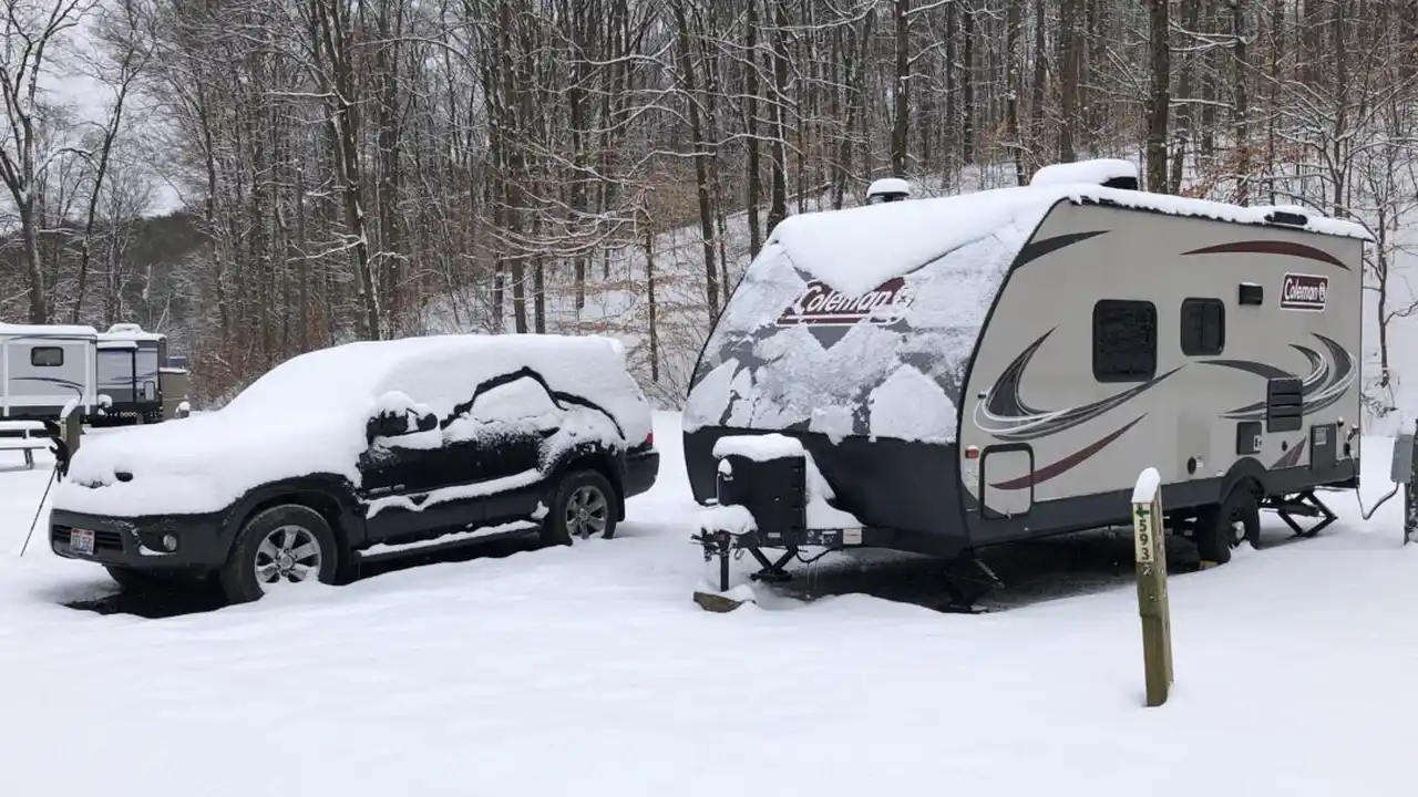 Close up on a plate of mashed potatoes, topped with baked pork chops with cream of mushroom soup, and a side of green beans.